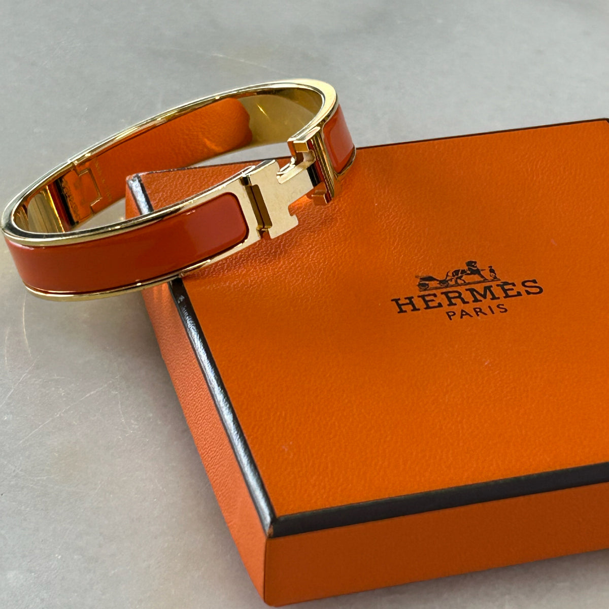 HERMÈS - Clic H Bracelet Orange & Gold GM
