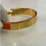 HERMÈS - Clic H Bracelet Orange & Gold GM
