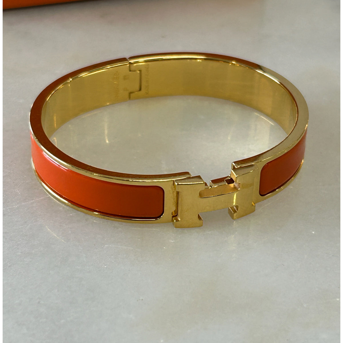 HERMÈS - Clic H Bracelet Orange & Gold GM