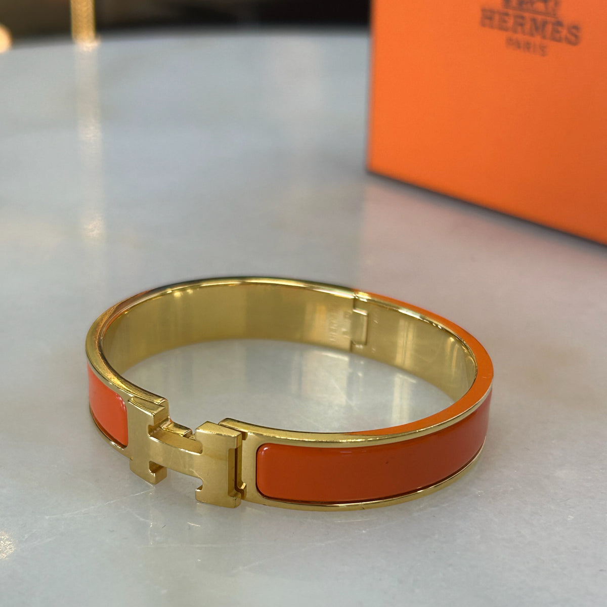 HERMÈS - Clic H Bracelet Orange & Gold GM
