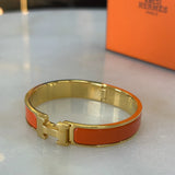 HERMÈS - Clic H Bracelet Orange & Gold GM