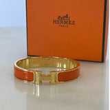 HERMÈS - Clic H Bracelet Orange & Gold GM