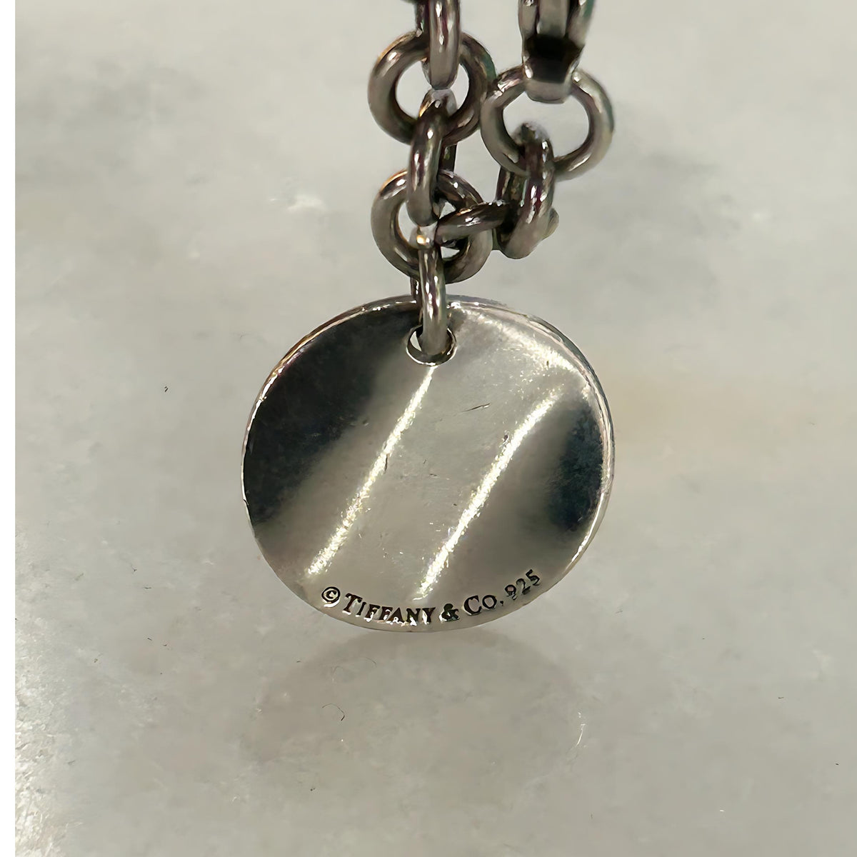 TIFFANY & Co. - Silver Notes Fifth Avenue Round Tag Bracelet