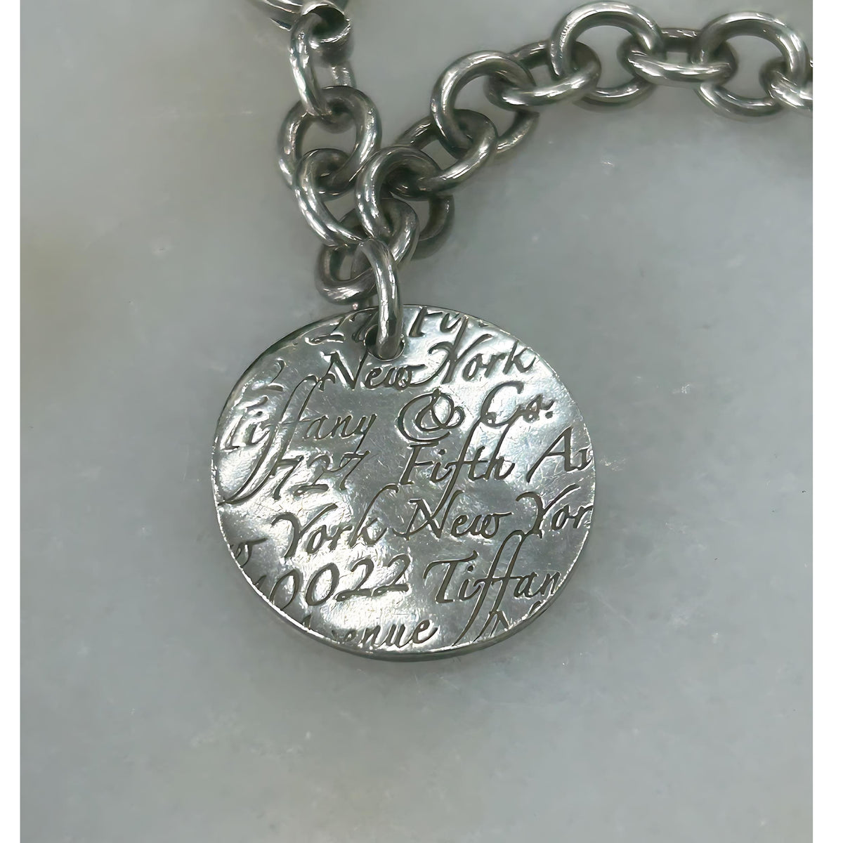 TIFFANY & Co. - Silver Notes Fifth Avenue Round Tag Bracelet