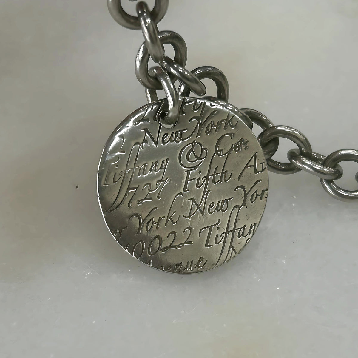 TIFFANY & Co. - Silver Notes Fifth Avenue Round Tag Bracelet